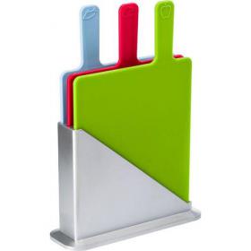 Three piece plastic cutting board set in a silver coloured holder; each cutting board is matched to a specific food group: blue is for fish and seafood, red is for poultry and meat, and green is for fruit and vegetables.  